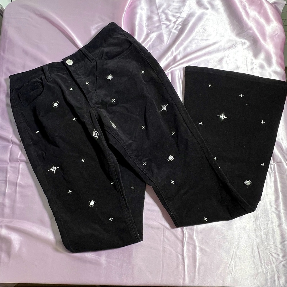 black flared corduroy jeans with cool white graphics
